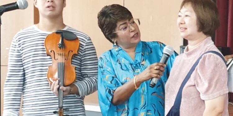 She Jun Wei (with violin), is a testament to the fact that disability is no barrier to thriving