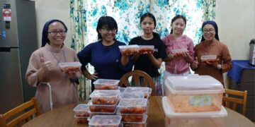 Sisters and students sharpen their skill in kimchi-making  for fundraising bazaar