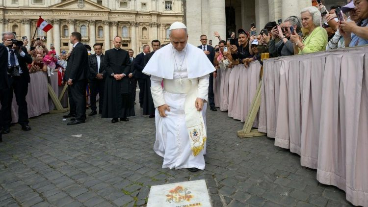 Pope Leo XIV prays at the spot where St John Paul II was shot